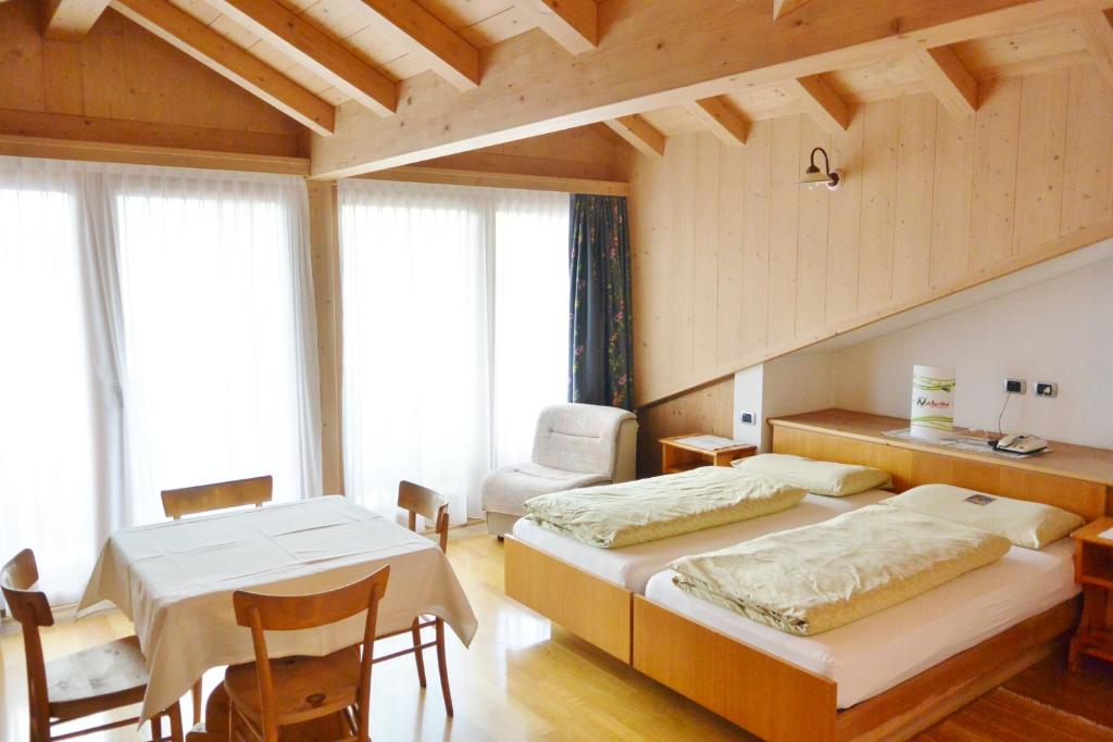 Postel nebo postele na pokoji v ubytování Hotel Garnì al Plan