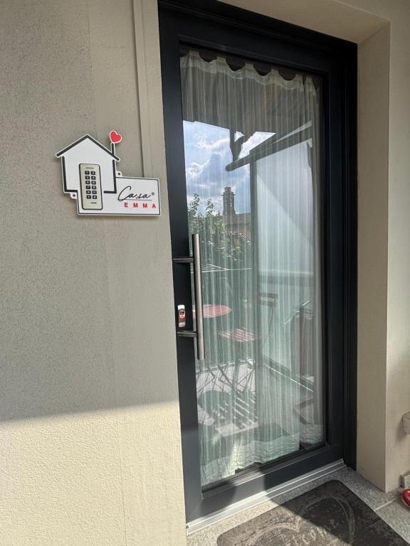 a door with a window with a view of a city at Casa Emma Homestay in Alba city center in Alba