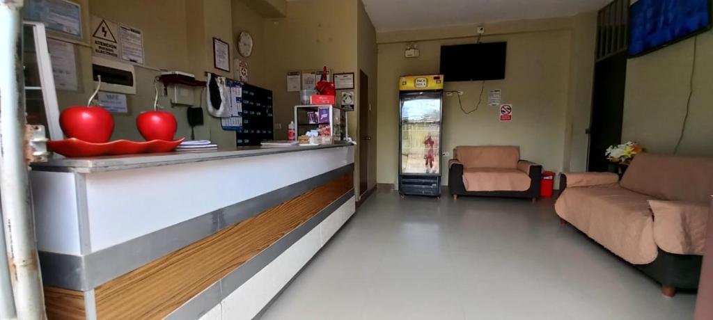 a pharmacyacistacist with a counter in a waiting room at Hospedaje Miramar in Máncora