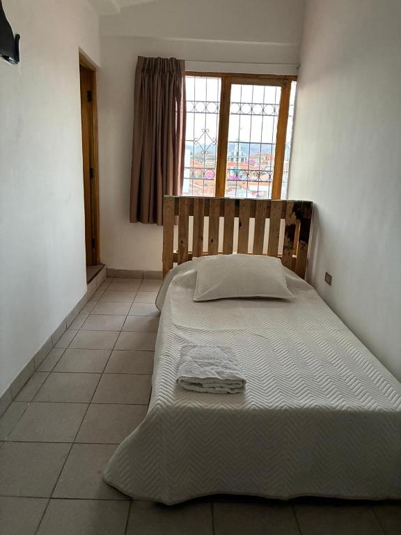 Ένα ή περισσότερα κρεβάτια σε δωμάτιο στο Habitacion Suite Centro Tarija