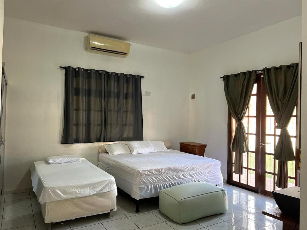 Postel nebo postele na pokoji v ubytování Casa em Benevides Cop 30