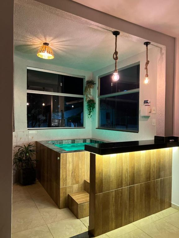 a kitchen with a blue counter top in a room at Casa design Piri no centro de Pirenópolis in Pirenópolis