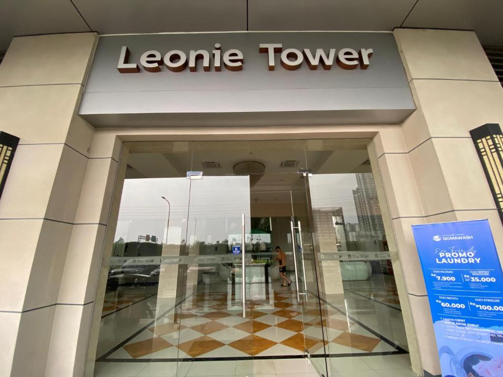 a le centre tower sign in front of a building at Apartment Sky House BSD By Moza Property in Cilenggang