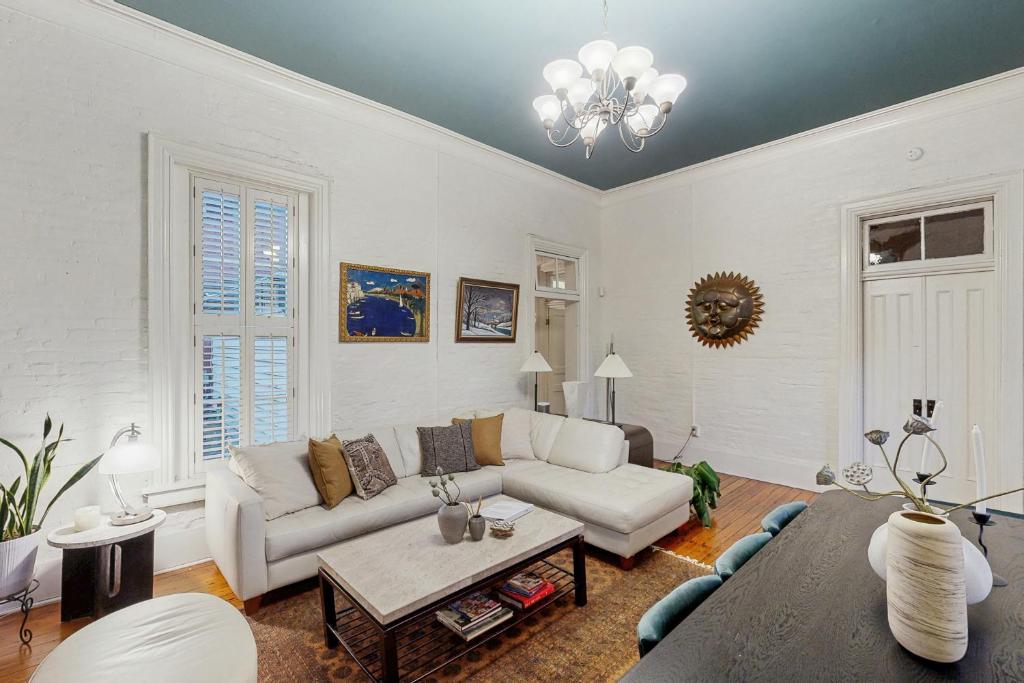 a living room with a couch and a table at Germantown Grand Home in Nashville