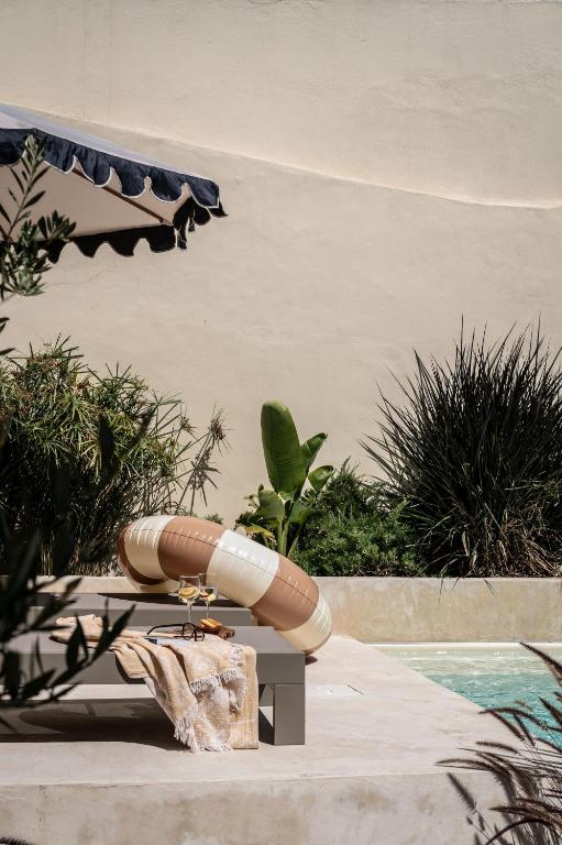 a inflatable next to a swimming pool at Casa Piccadilly - Óbidos Design Villa, Surf & Golf in Sobral