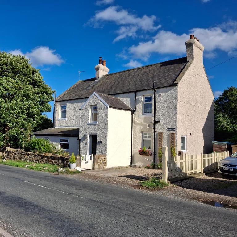 an old house on the side of the road at Littlebeck in Danby