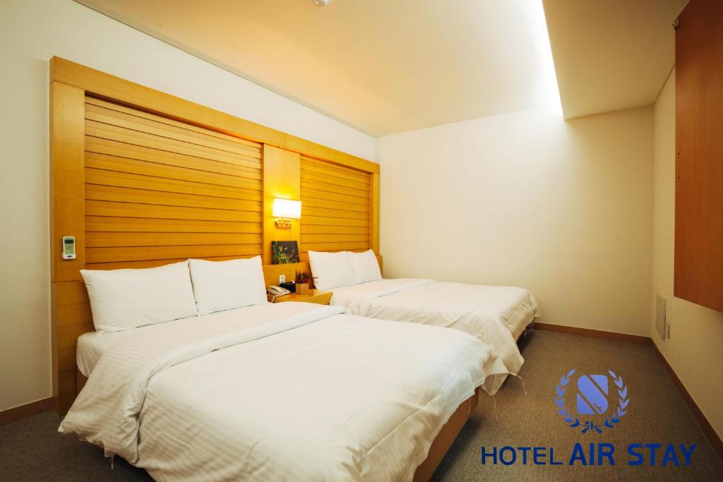 Postel nebo postele na pokoji v ubytování Incheon Airporthotel Airstay
