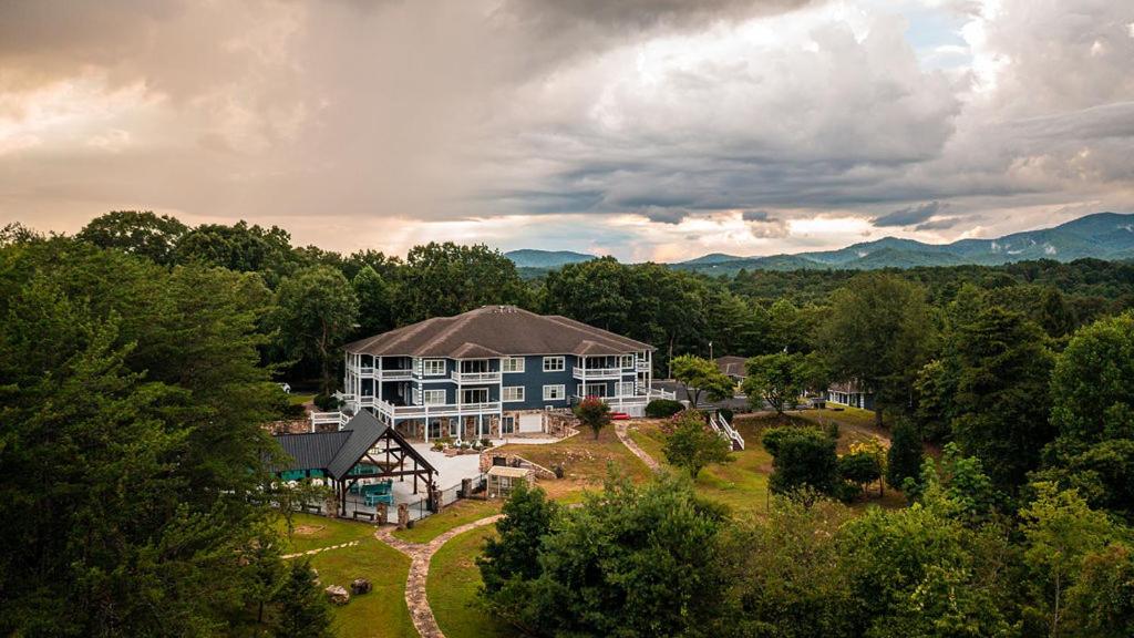 an aerial view of a large house in the mountains at The Ellijay Resort in Ellijay