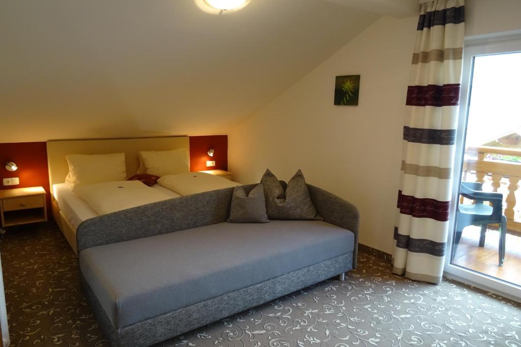 Postel nebo postele na pokoji v ubytování Pension Appartements Reithof