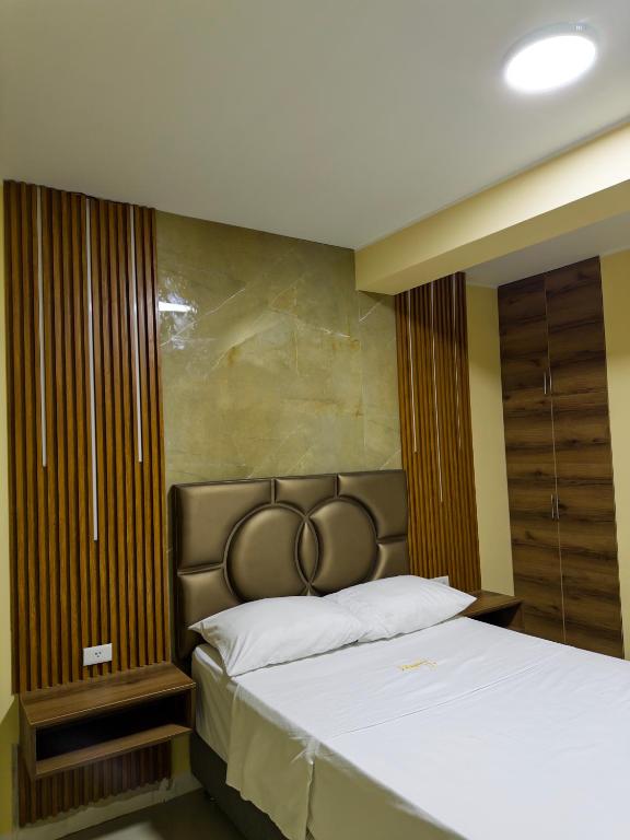 Ένα ή περισσότερα κρεβάτια σε δωμάτιο στο Hotel D'Angeles