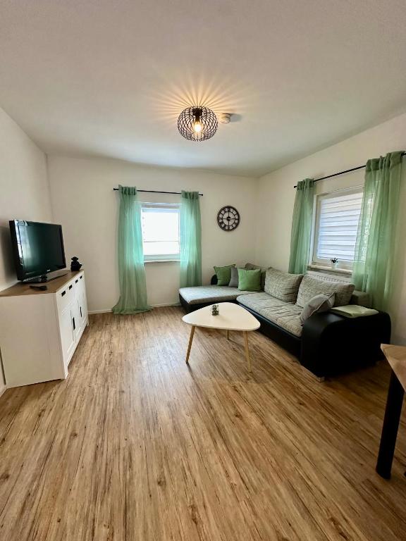 a living room with a couch and a table at Stilvolle 2 Zimmerwohnung in Fellbach
