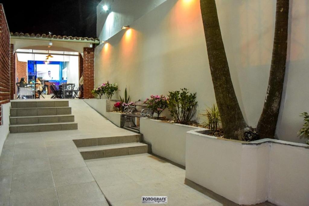 a patio with stairs and a tree in a building at Elegant House with Party Room in Santana do Livramento