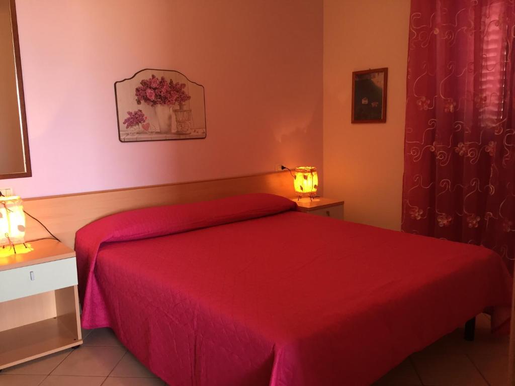 Łóżko lub łóżka w pokoju w obiekcie Villa Marilena
