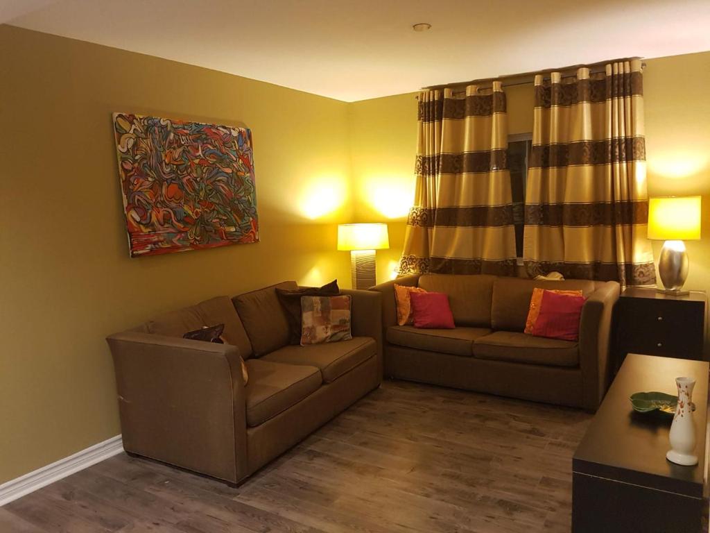 a living room with a couch and a table at Orchard Cottage - Honeycrisp in Aurora