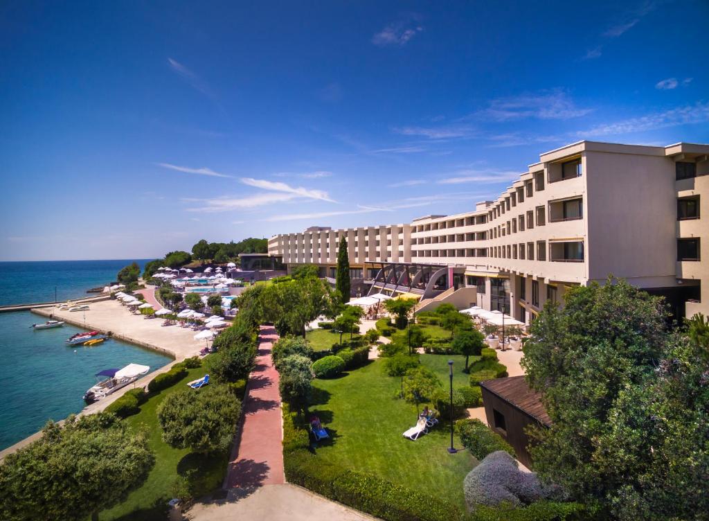 
a large building with a view of the ocean at Island Hotel Istra in Rovinj
