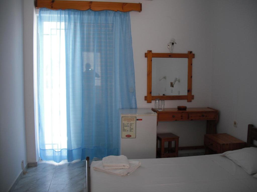 Postel nebo postele na pokoji v ubytování Antonis Hotel