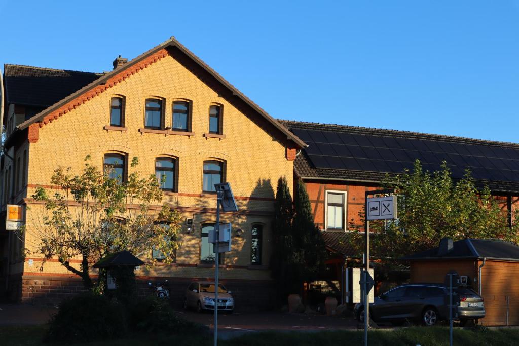 a house with solar panels on the side of it at Hotel-Restaurant zur Post in Wabern
