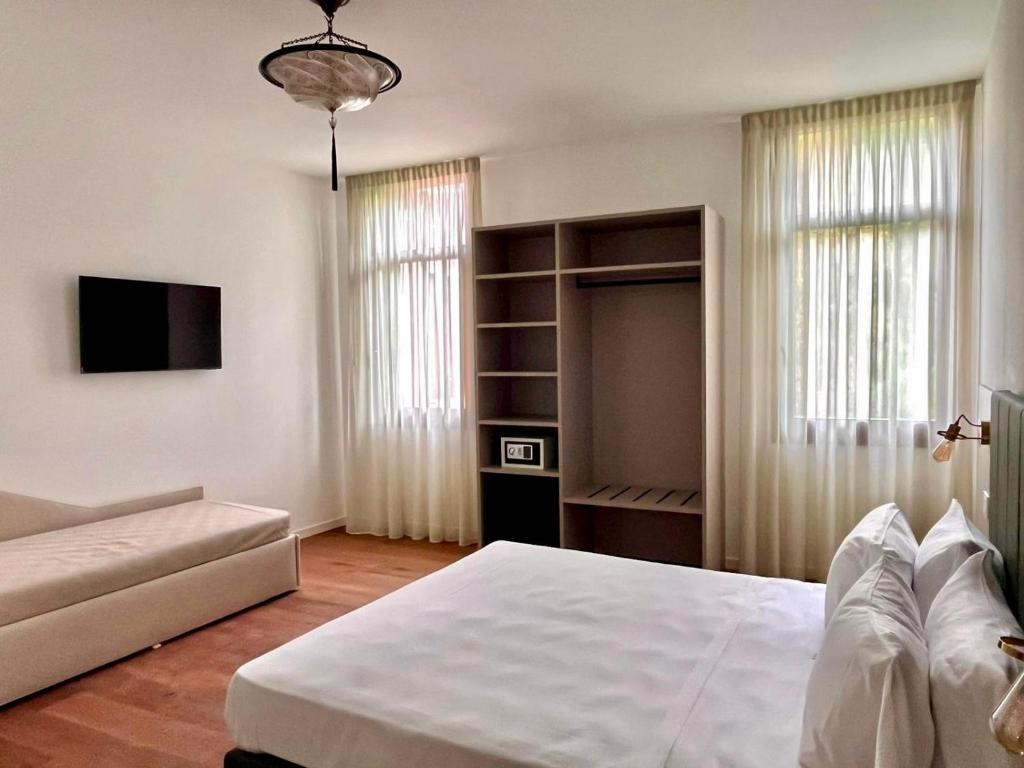 Postel nebo postele na pokoji v ubytování Casanova Hideaway