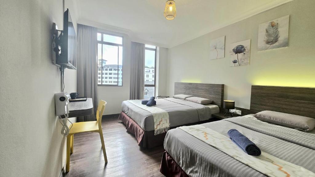 Ένα ή περισσότερα κρεβάτια σε δωμάτιο στο Parkland Hotel