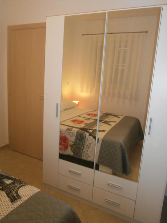 Postel nebo postele na pokoji v ubytování Apartmani Perak