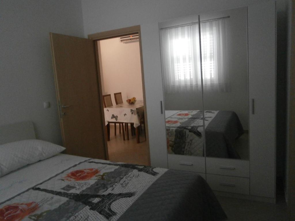 Postel nebo postele na pokoji v ubytování Apartmani Perak