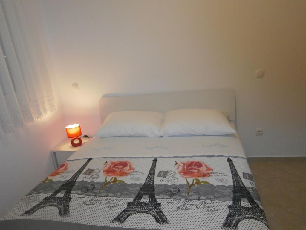 Postel nebo postele na pokoji v ubytování Apartmani Perak