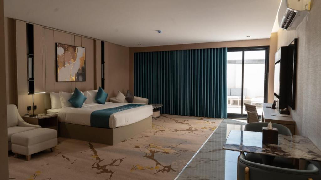 Postel nebo postele na pokoji v ubytování فندق روزا جراند غرناطه Rosa Grand Hotel Granada