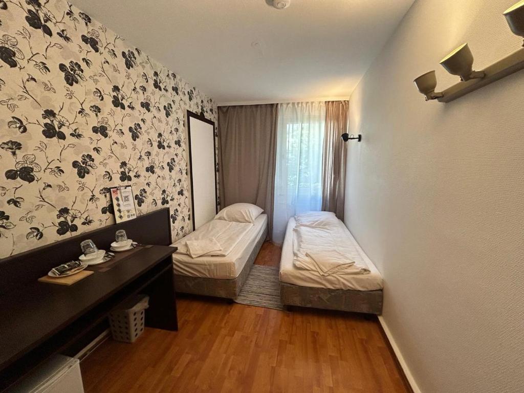 Postel nebo postele na pokoji v ubytování WestEnd#101