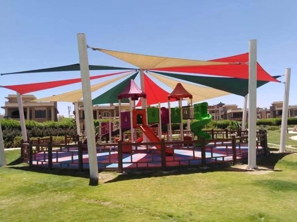 a playground with a colorful tent and chairs at بلو باي اسيا للعائلات فقط in Ain Sokhna