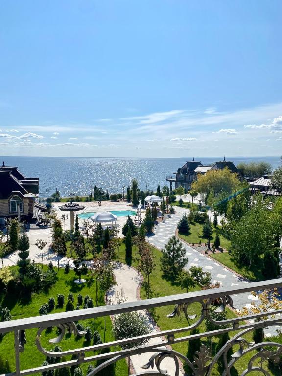 a view of a resort with a pool and the ocean at Dacha Del Mar in Yasnogorodka