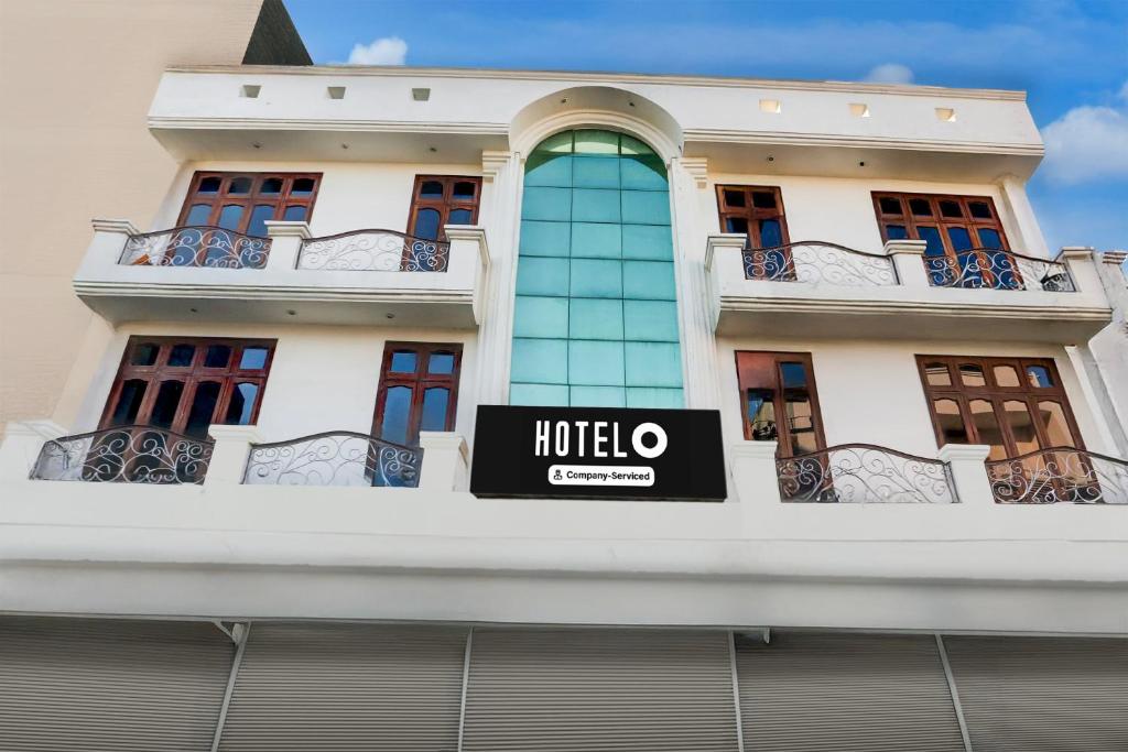 a hotel sign on the side of a building at Hotel O by OYO Subhani Building Formerly Hotel Amandeep in Ludhiana