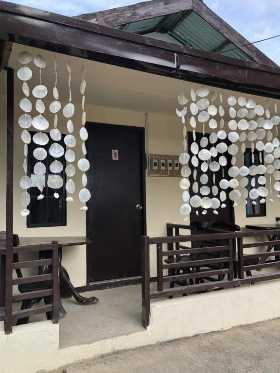 a building with a bunch of white spheres on it at Cabugao Lodge in El Nido