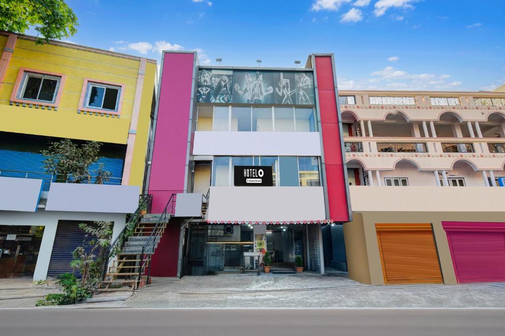 a view of a building with colorful buildings at Hotel O Neredmet Road in Hyderabad