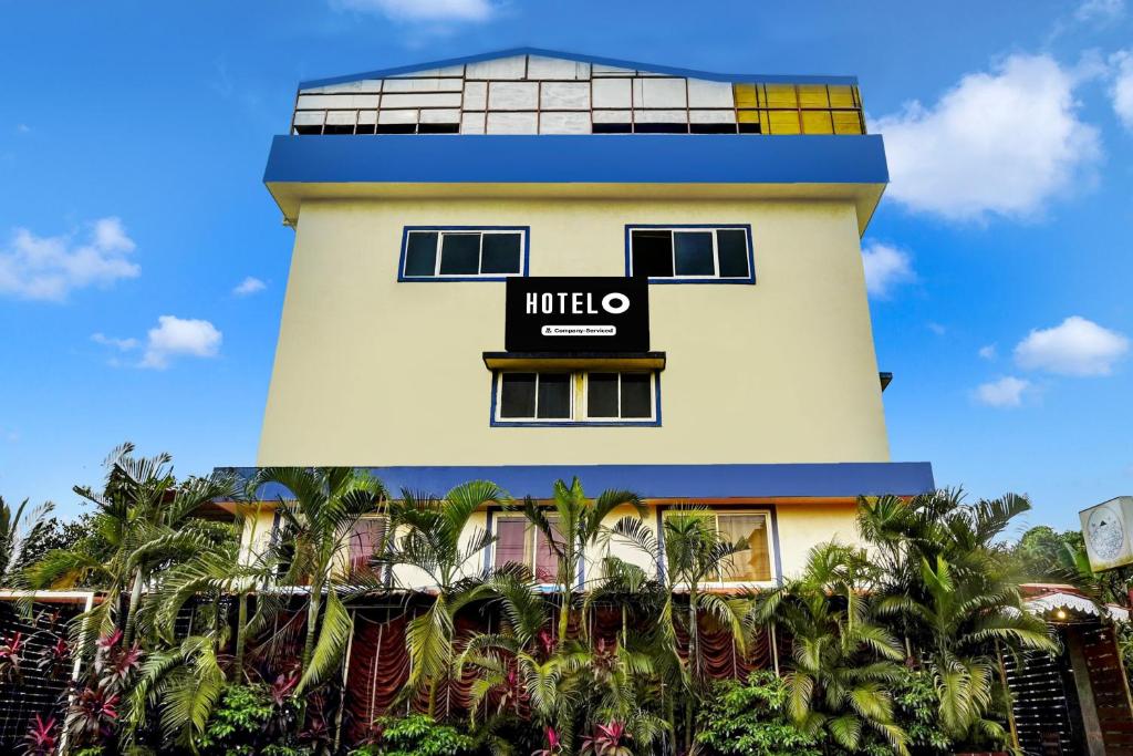 a building with a sign that reads mitzo at Hotel O Porvorim Near Mall De Goa in Goa