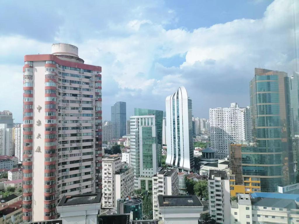 a view of a city skyline with tall buildings at Fanhua Life IN Nanjing West Road Store 2 in Shanghai