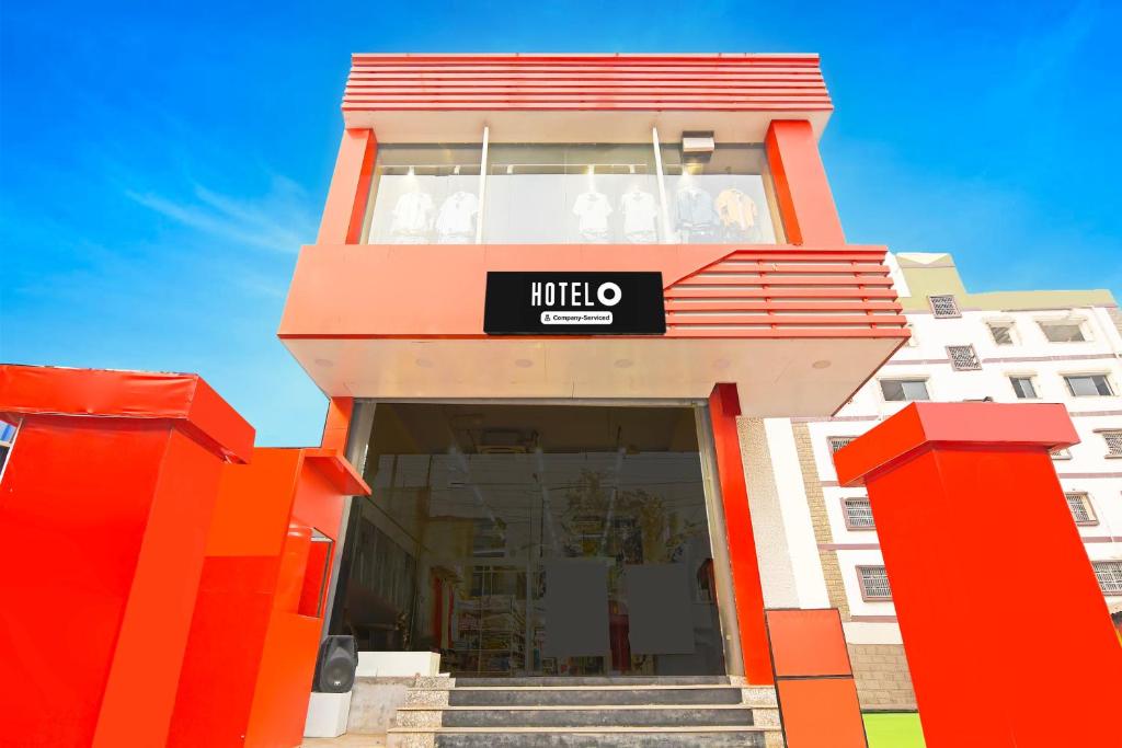 a building with an orange and white building at Super Hotel O Santragachi Junction Formerly Hotel Shubra in Kolkata