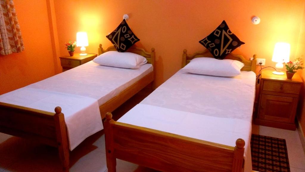 Postel nebo postele na pokoji v ubytování Basilico Homestay