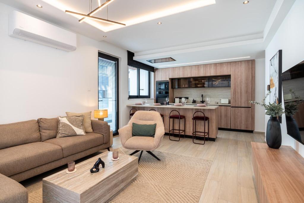 a living room with a couch and a table at Densho 2-Bedroom Luxury Apartment in Larnaka