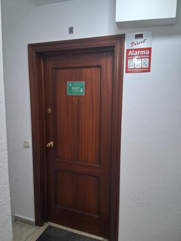 a door in a room with a sign on it at Nueva 6 in Algeciras