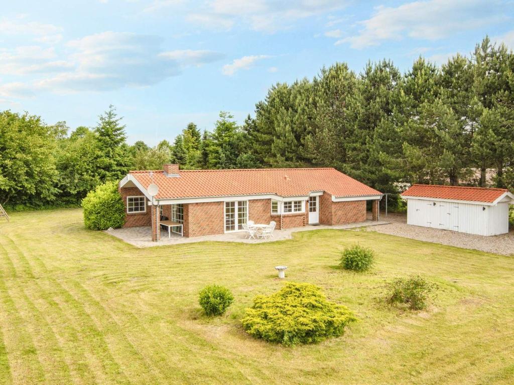 a home with a large yard with a house at 8 person holiday home in Ørsted-By Traum in Kare