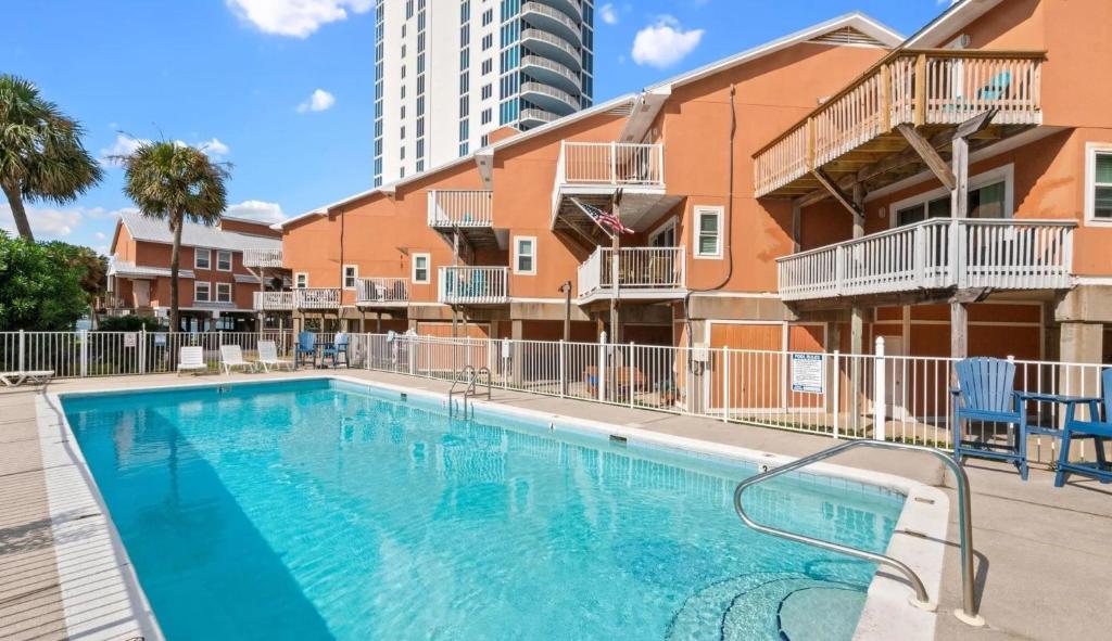 an image of a swimming pool at a apartment complex at Laguna Bella in Gulf Shores