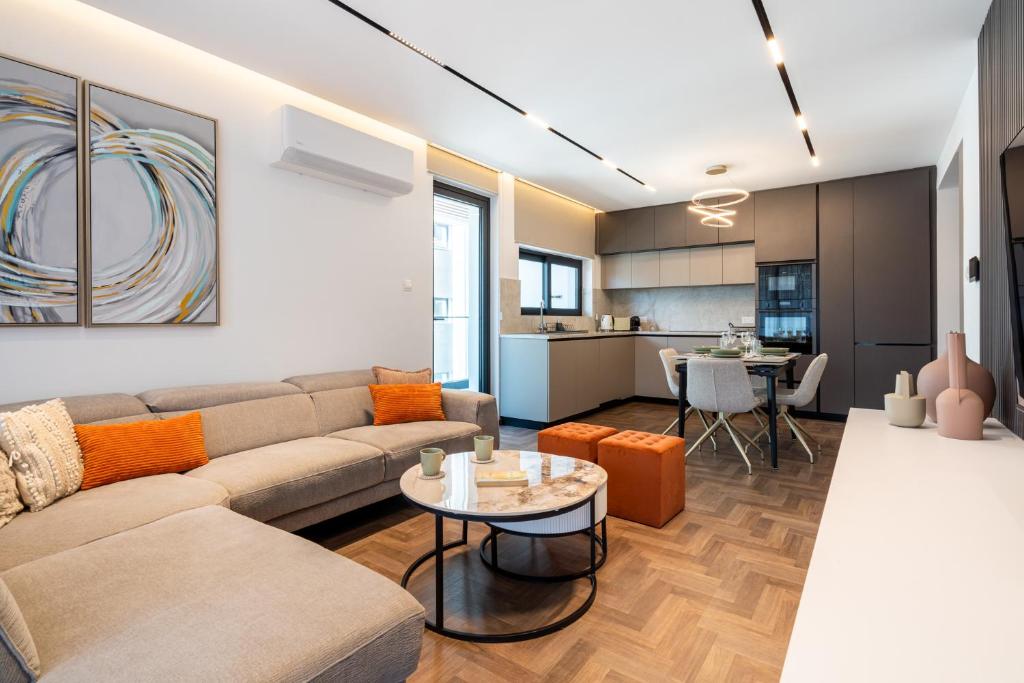 a living room with a couch and a table at Itero 2-Bedroom Luxury Apartment in Larnaka