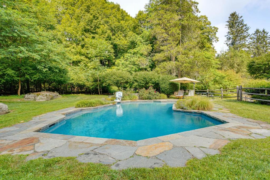 a swimming pool in the middle of a yard at Bedford Retreat 15 Mi to Long Island Sound in Bedford