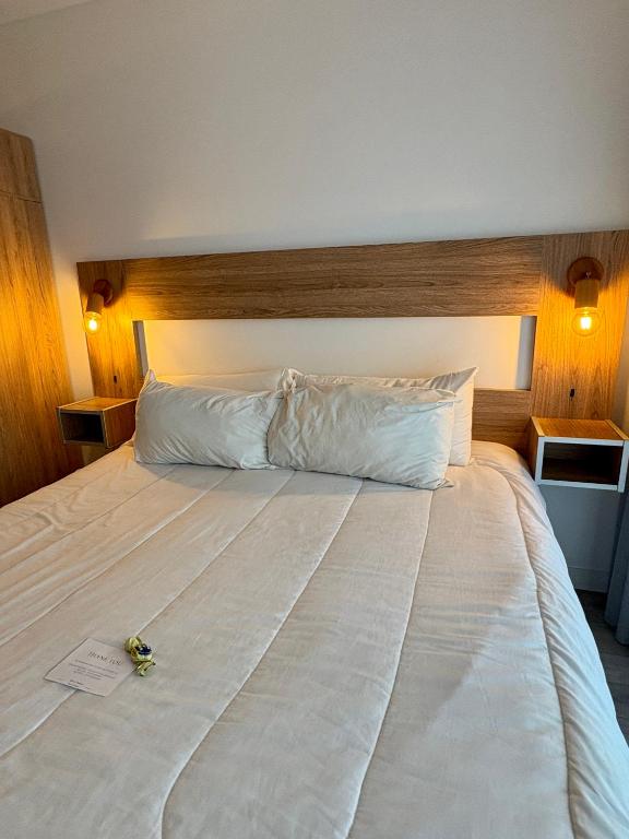a large white bed in a hotel room at Moon House San Telmo in Buenos Aires