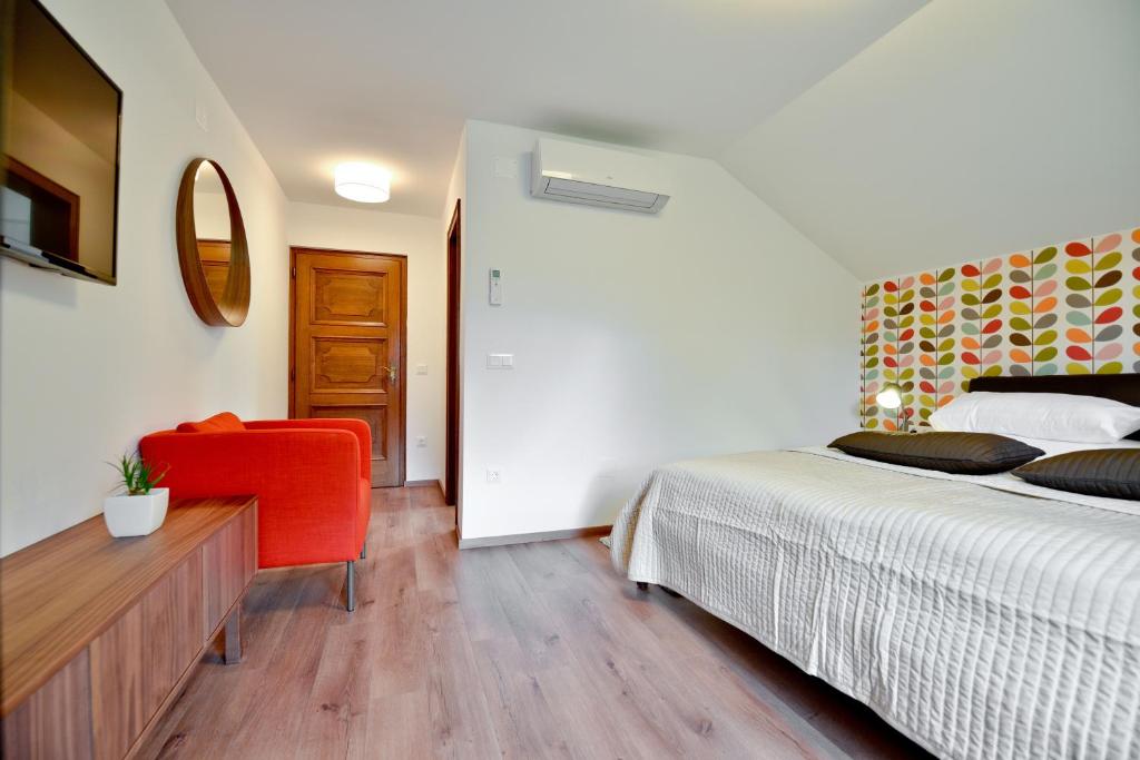Postel nebo postele na pokoji v ubytování Vila Laura