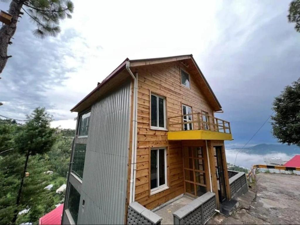 a house being constructed on a hillside at RBS Cottage in Murree
