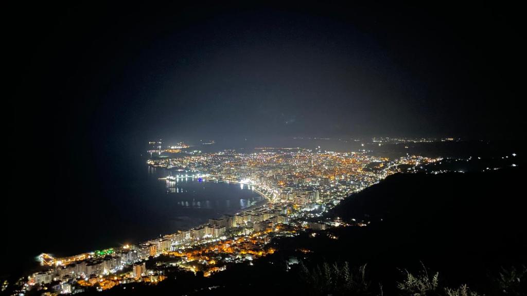 a view of a city at night at Il Nido del Viaggiatore in Orikum