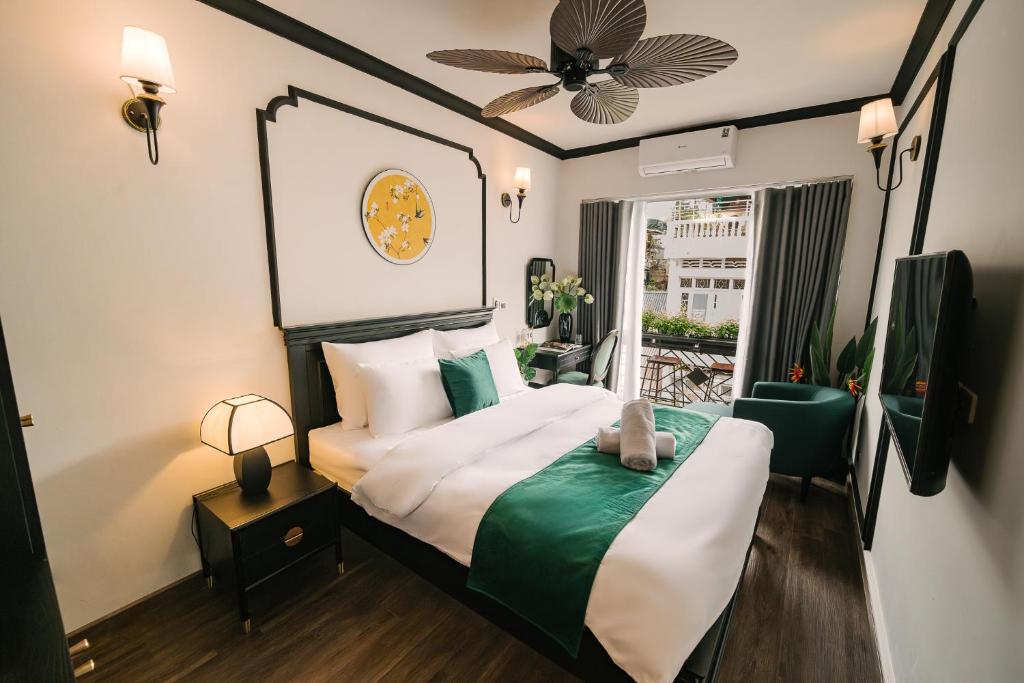 a hotel room with a bed and a window at Willow Hanoi Old Quarter in Hanoi