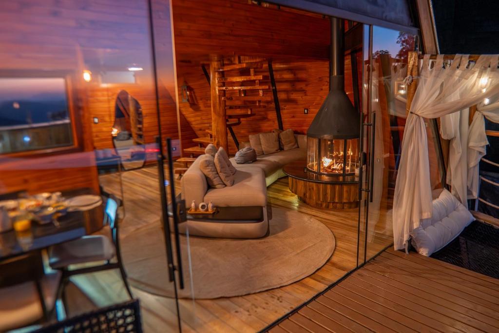 Posezení v ubytování Chalé Boutique- Spa Campos do Jordão