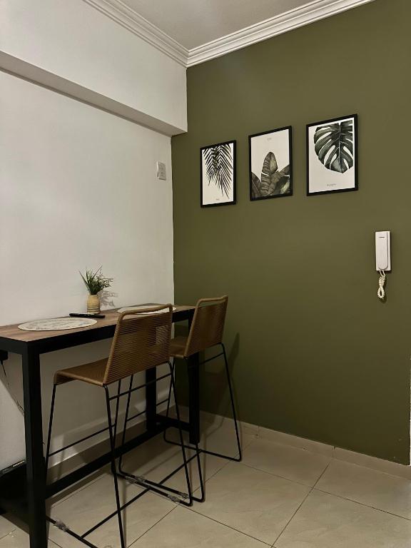 a dining room with a table and two chairs at El lapacho 2 in Santiago del Estero